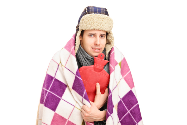 image of a homeowner feeling chilly due to running out of home heating oil