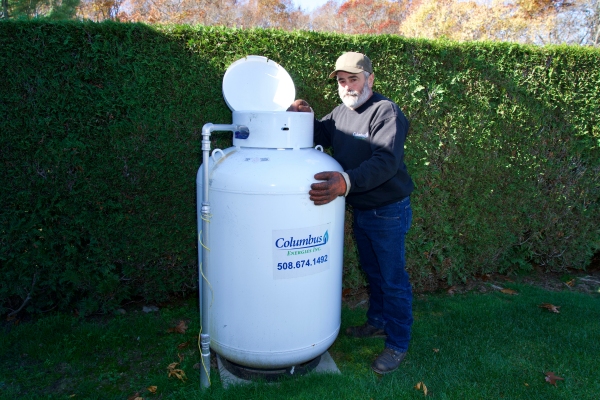 Columbus Energies staff inspecting propane tank for a residential client