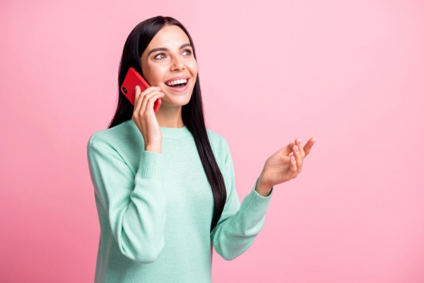 woman on the phone calling for oil delivery depicting will-call oil delivery option