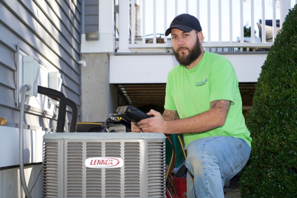 Columbus Energies HVAC technician performing HVAC maintenance for a client