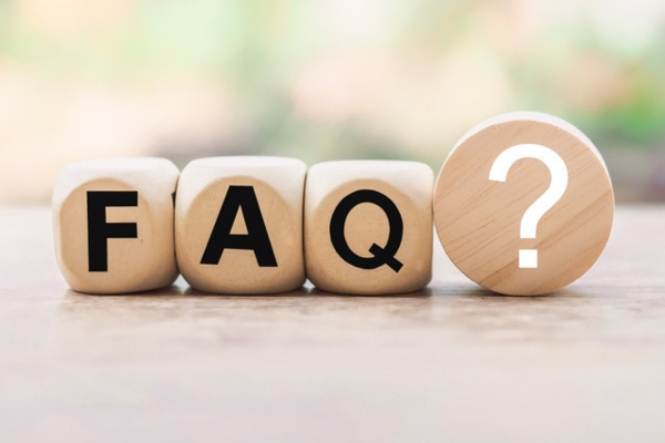 FAQ spelled using wooden letter dice depicting questions about HVAC contractor