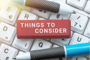 things to consider written on a pencil eraser on top of a keyboard depicting choosing an HVAC contractor