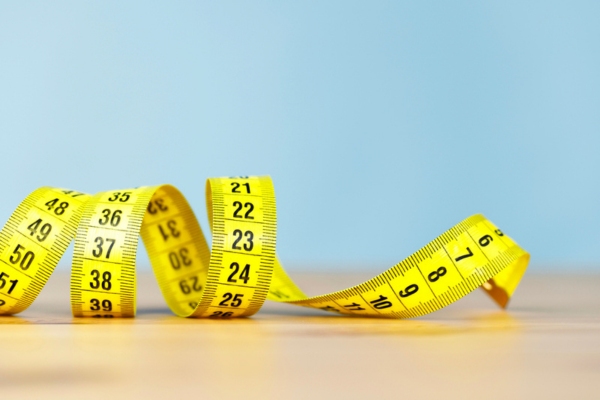 yellow measuring tape depicting sizing standby generator