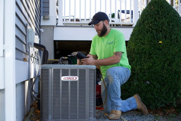 Columbus Energies HVAC technician installing air conditioner