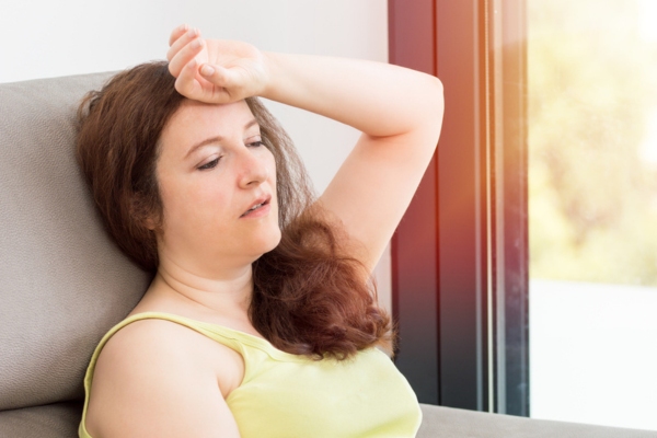 woman feeling hot due to AC mechanical breakdown