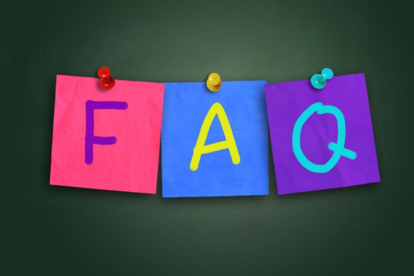 FAQ written on colored paper pinned on a board depicting air conditioner care questions