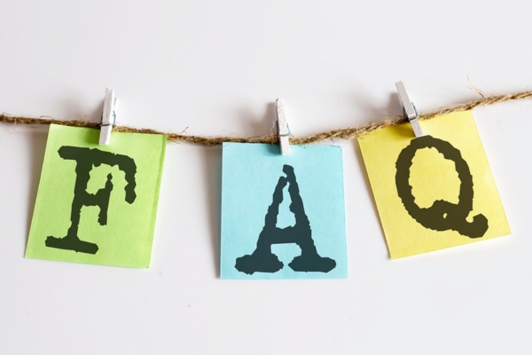 FAQ stamped on colored papers clipped on a thin rope depicting questions about Standby Generator Replacement