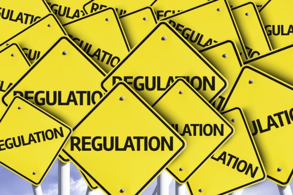 Regulation written on multiple road sign depicting propane