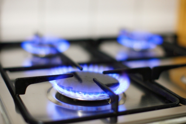 close up of blue flame on propane stove burner