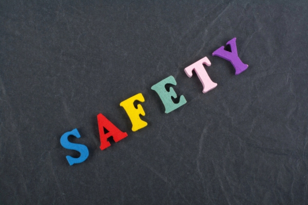 safety spelled using colorful wooden letters depicting storing propane tanks