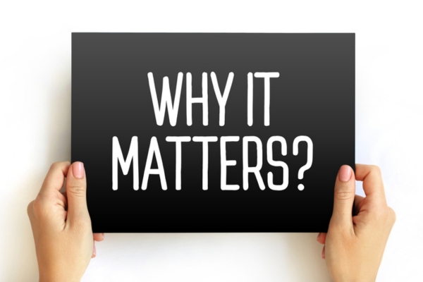Why it matters sign held by a woman's hands depicting Heating Efficiency Standards