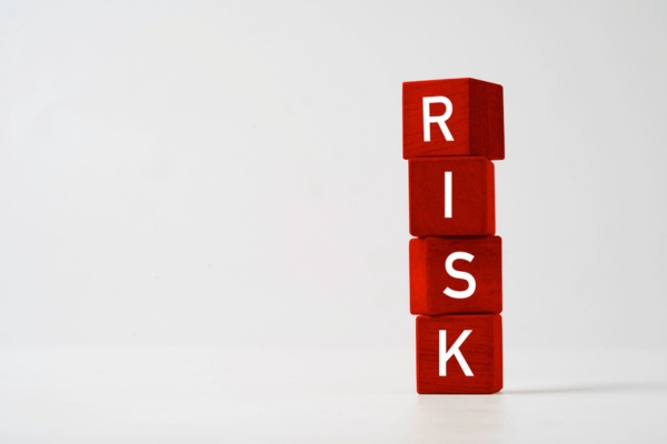 RISK spelled vertically using red letter cubes depicting Cracked Heat Exchanger