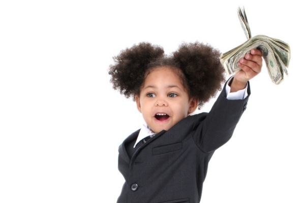 young kid wearing a suit holding a stack of cash