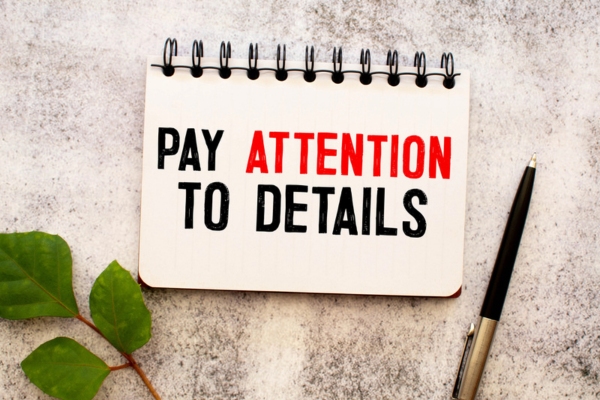 pay attention to details written on a notepad depicting Heating System Sizing