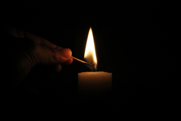 lighting a candle during power outage