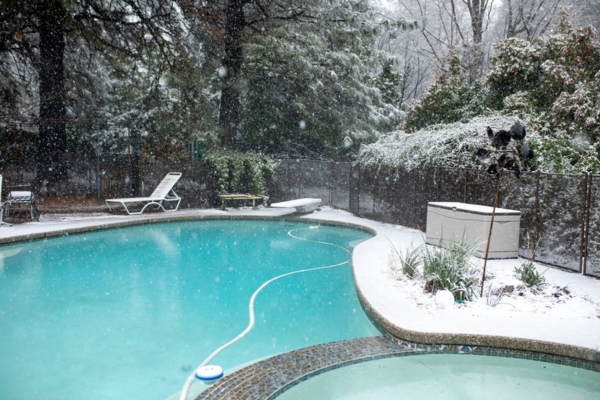 backyard pool during snow