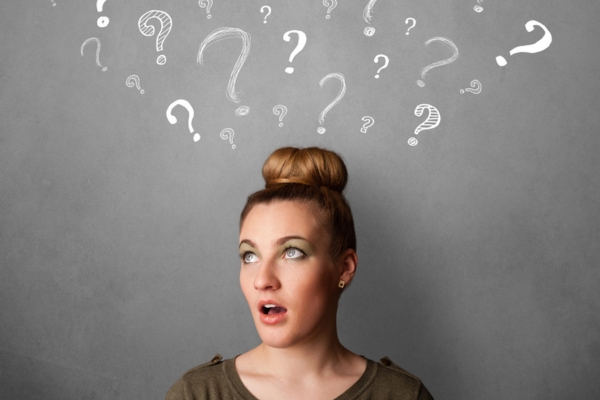 Young woman with question marks above her head depicting Diagnosing Your Standby Generator