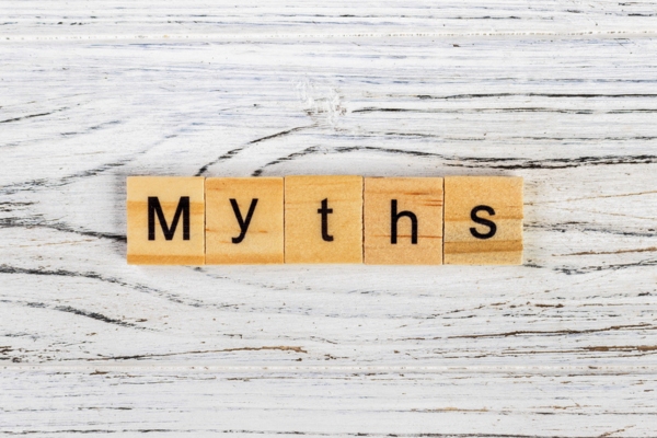 Myths spelled using wooden letter chips depicting Heating And Cooling Misconceptions