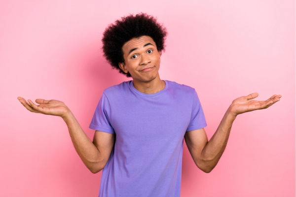 man shrugging with both hands raised on the side depicting What Leads To Hot And Cold Spots In Your Home