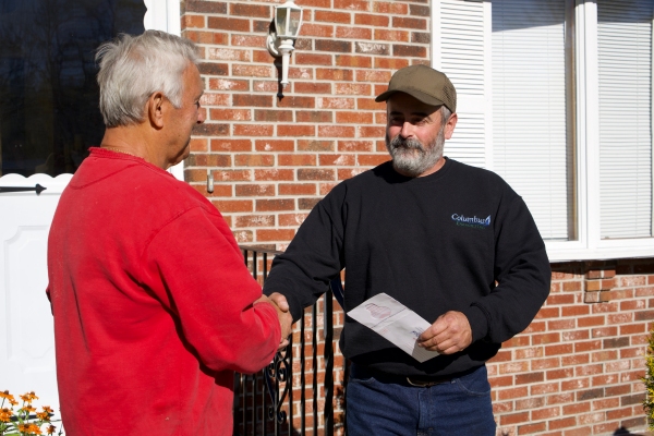 Columbus Energies staff and customer handshake