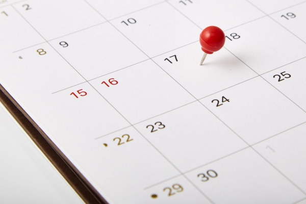 red pin on a calendar for an HVAC service schedule