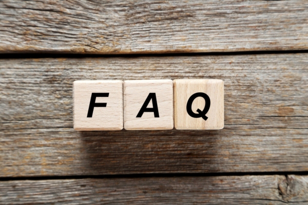 FAQ spelled using wooden letter cubes depicting Air Conditioning Scams questions