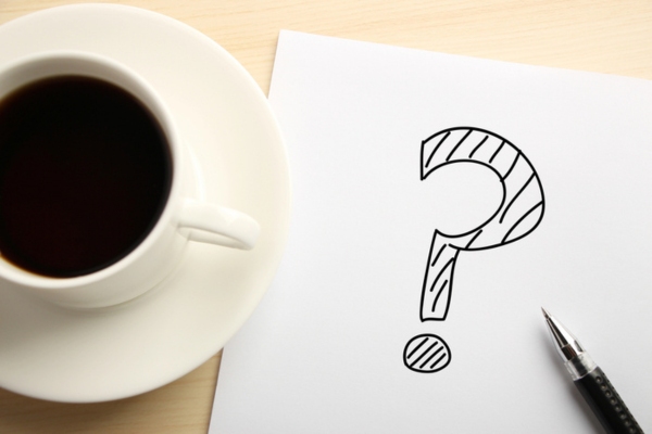 question mark doodled on a paper depicting Air Conditioning Health Effects FAQs