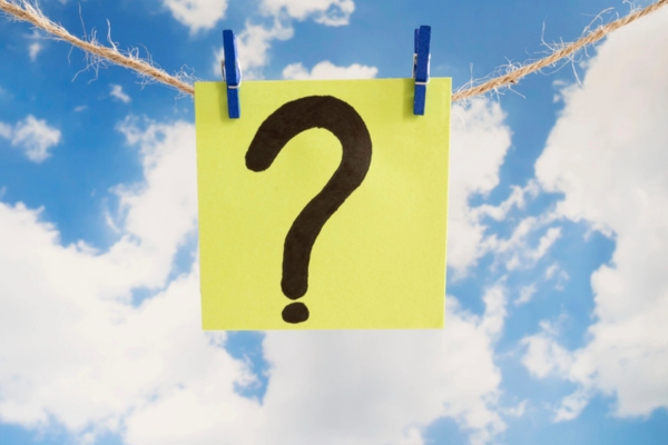 question mark written on paper and hanging on a thin rope depicting Why Does the Fan Keep Running on My Air Conditioner FAQs