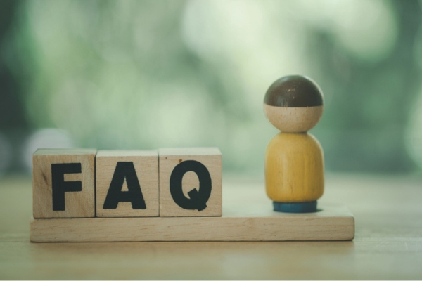 FAQ spelled using wooden letter cubes with miniature man carving on the side depicting Propane Tips questions