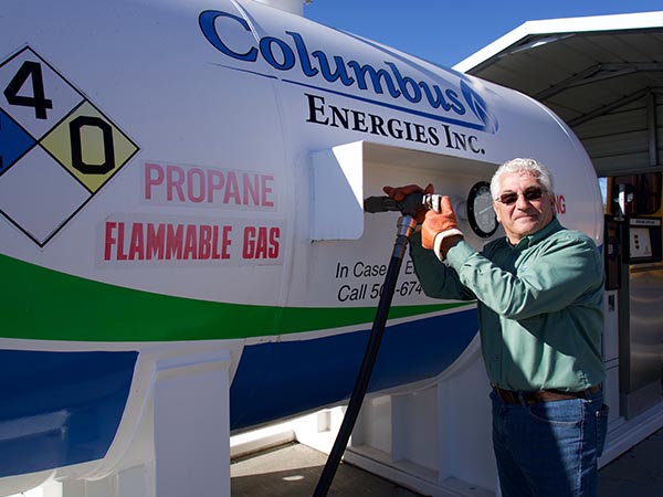 Middleboro, MA technician filling propane tank with delivery equipment