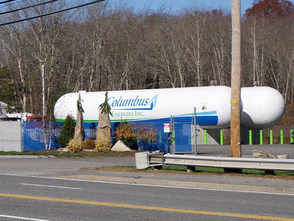 Middleboro, MA large propane tank at a delivery location with surrounding landscaping