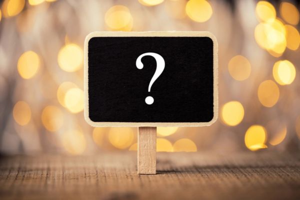 question mark on a mini chalkboard on a clip depicting FAQs About Trusted Heating Oil
